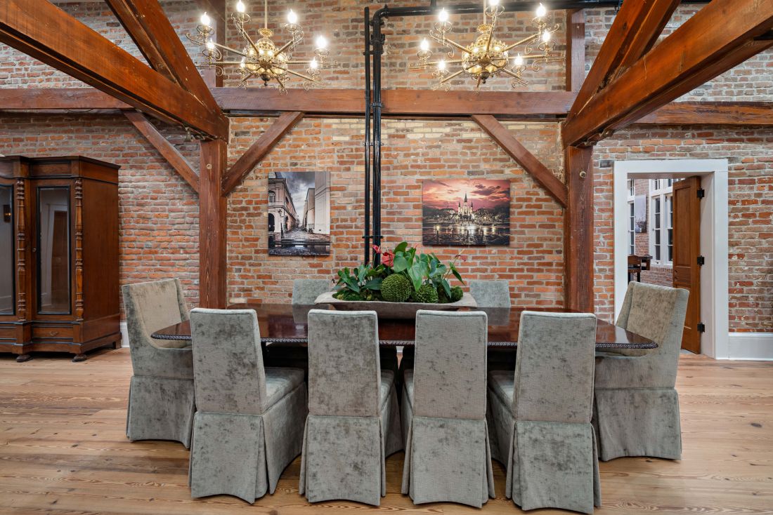 Dining table against old brick, 528 Wilkinson Street