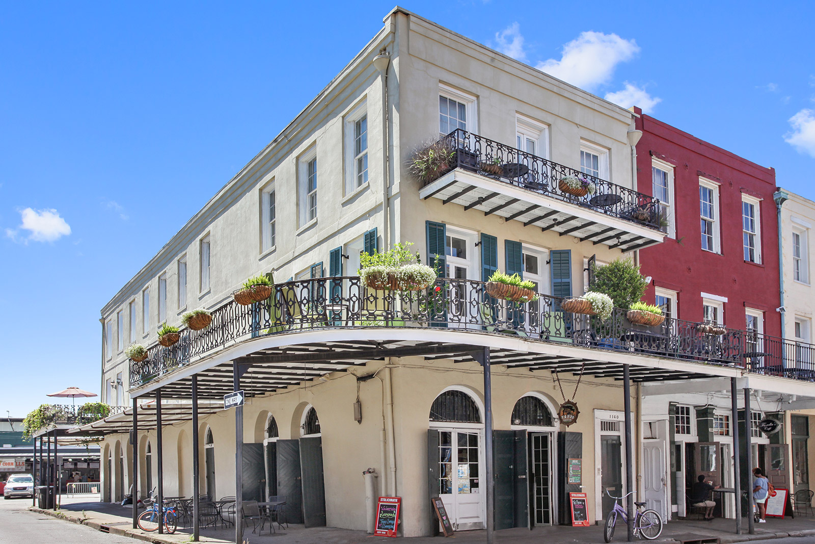 1140 Decatur Street French Quarter corner condo building with wrap-around gallery balcony — sold by Patrick Knudsen